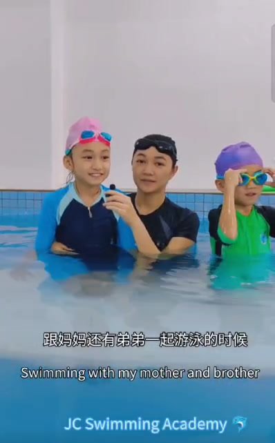 JC Swimming coach with students
